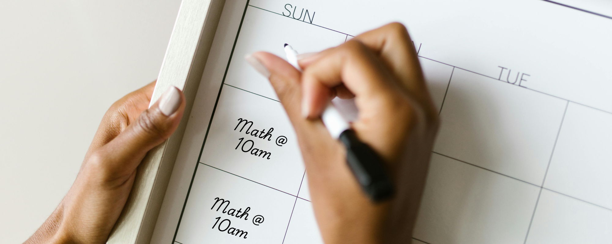 Photo of a womam writing math tutoring at 10am on her calendar every Sunday. Original phone by RDNE Stock project: https://www.pexels.com/photo/woman-writing-in-calendar-8581118/. Edited to add text 'Math at 10am' on Sundays.